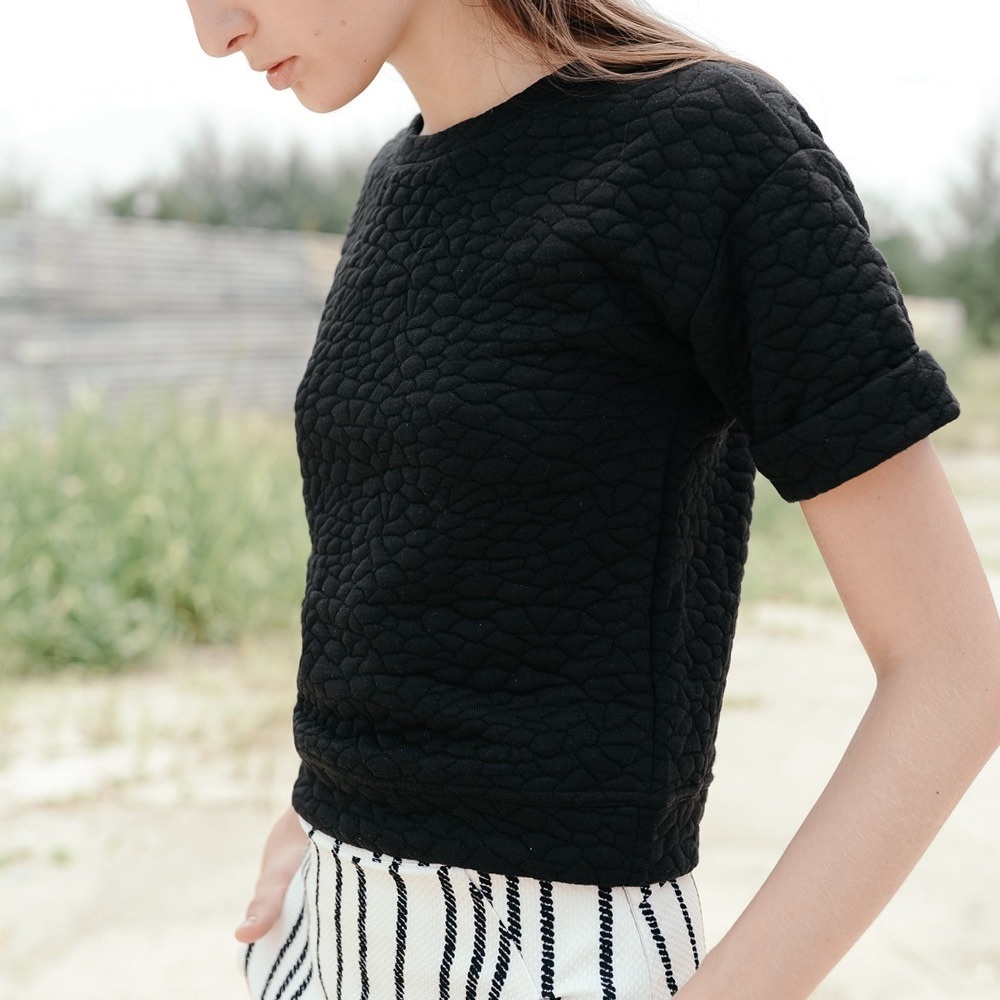 DAISY FUENTES | Quilted Black Short Sleeve Sweater with Button Accents